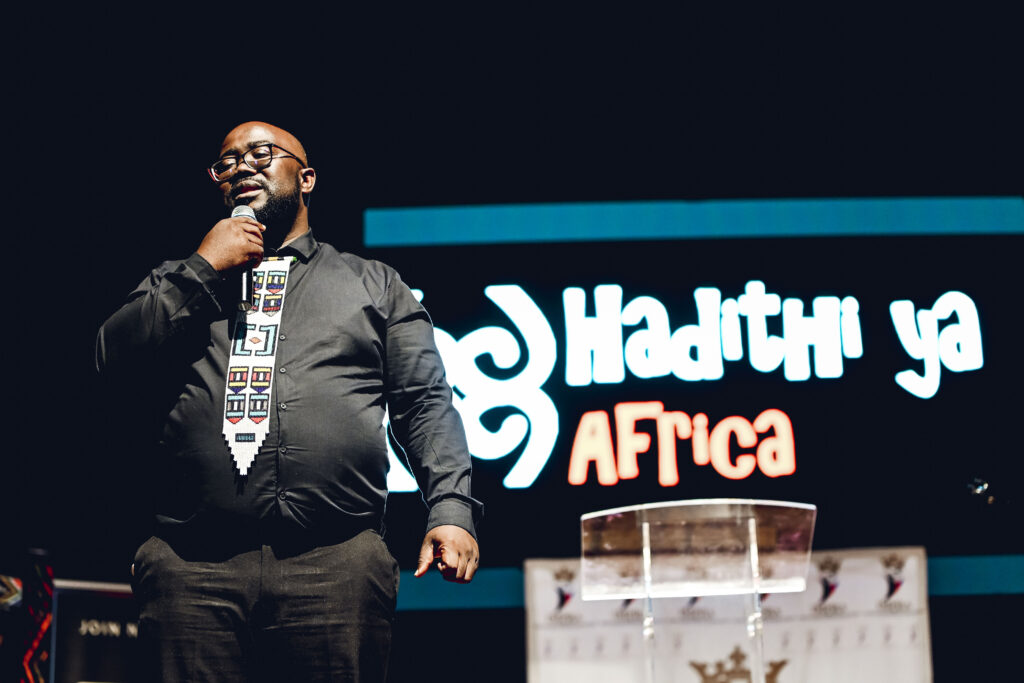 Thandwefika Tshabalala on stage in front of the Hadithi ya Africa backdrop
